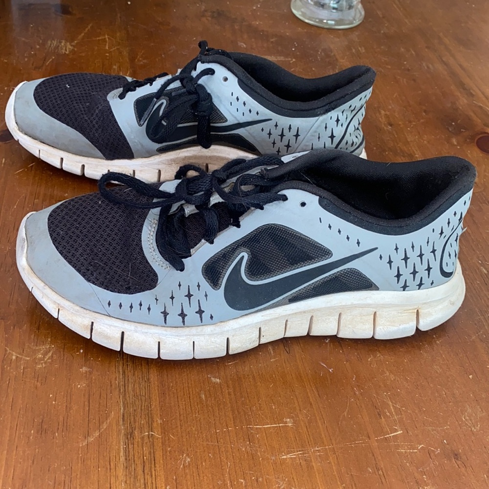 Very worn Nike tennis shoes